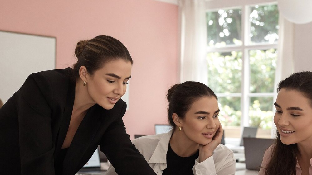 LV working with two women